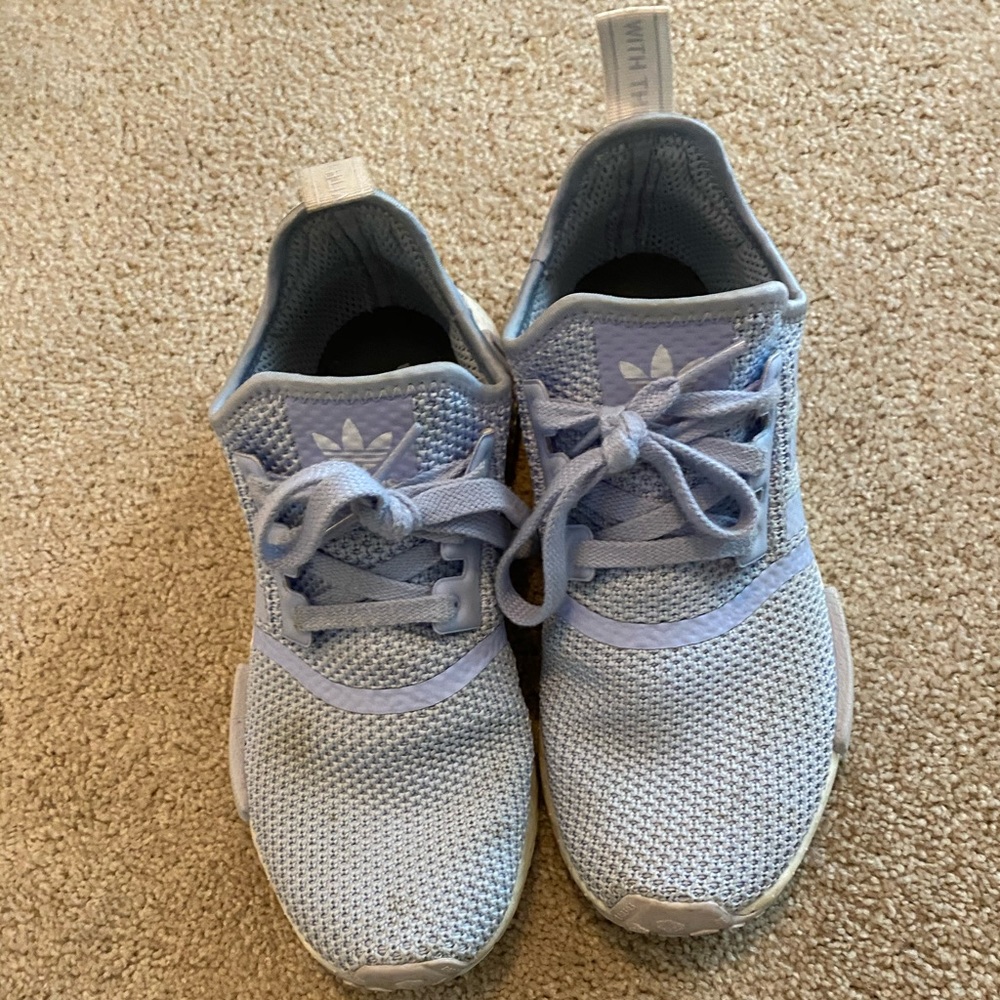 Light blue Adidas NMDs